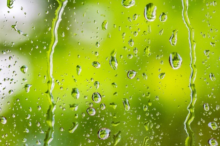 rain water dripping on the glass window